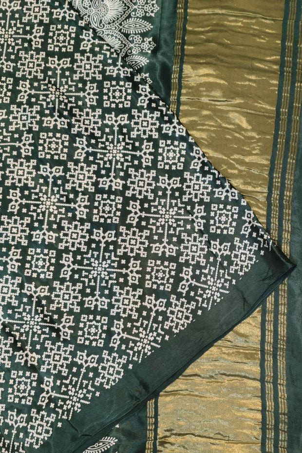 Modal silk saree in rangoli pattern in bottle green with lagda patti (zari)  pallu
