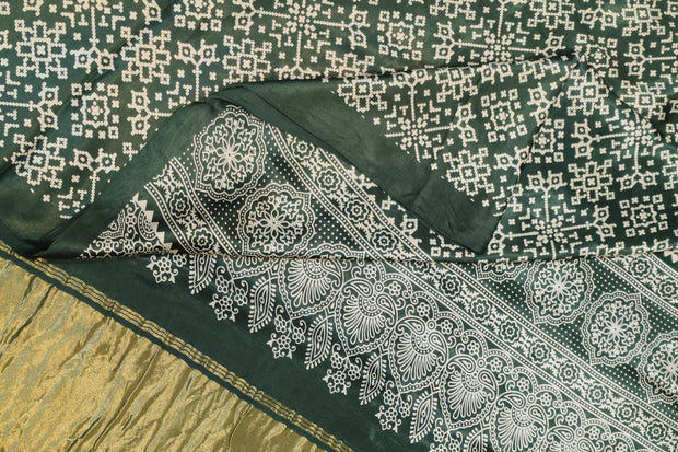 Modal silk saree in rangoli pattern in bottle green with lagda patti (zari)  pallu