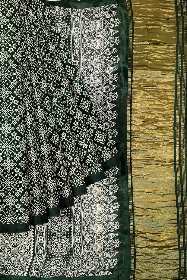 Modal silk saree in rangoli pattern in bottle green with lagda patti (zari)  pallu