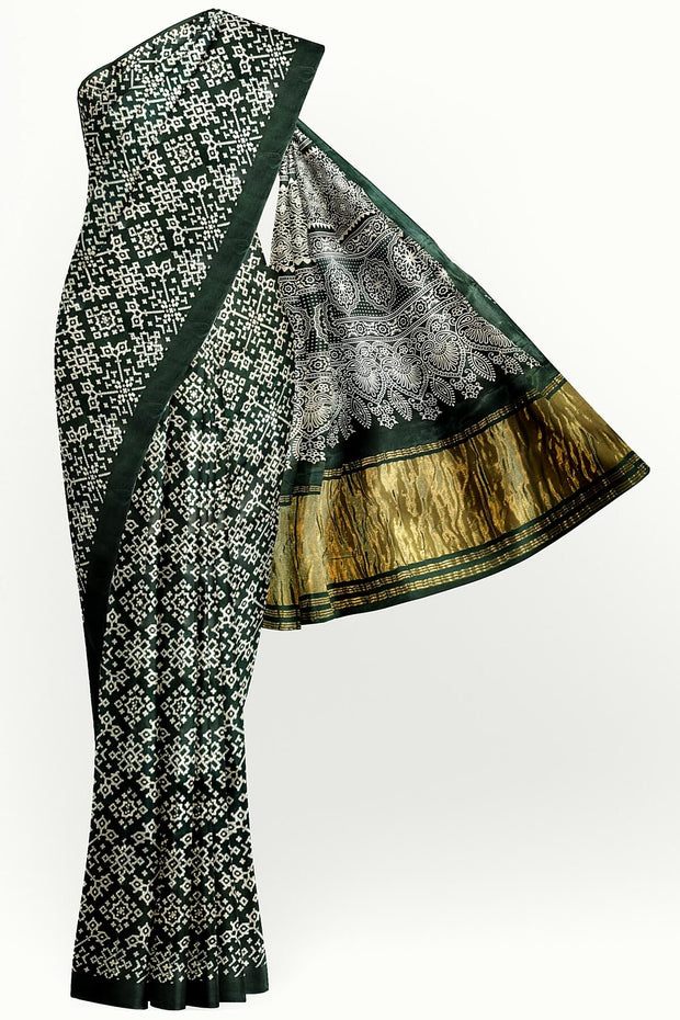 Modal silk saree in rangoli pattern in bottle green with lagda patti (zari)  pallu