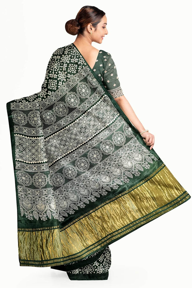 Modal silk saree in rangoli pattern in bottle green with lagda patti (zari)  pallu