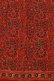 Modal silk saree in red in hand block ajrakh print in floral pattern