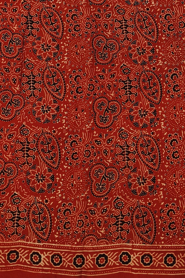 Modal silk saree in red in hand block ajrakh print in floral pattern