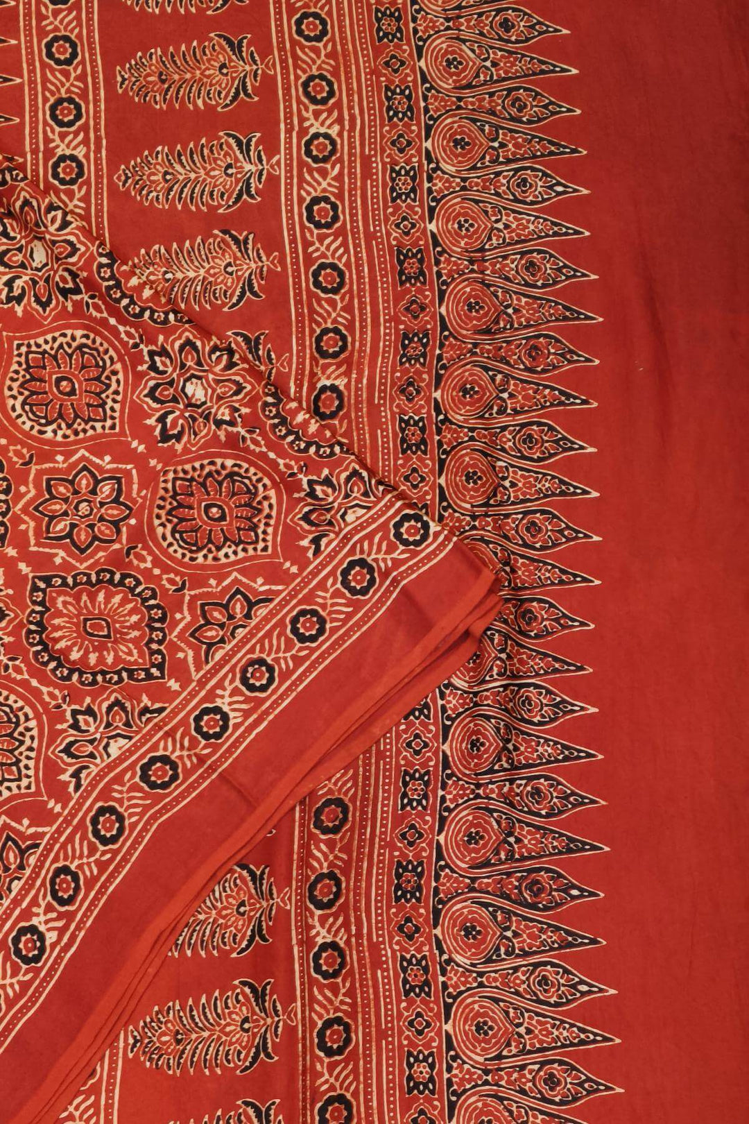 Modal silk saree in red in hand block ajrakh print in floral pattern
