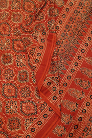 Modal silk saree in red in hand block ajrakh print in floral pattern