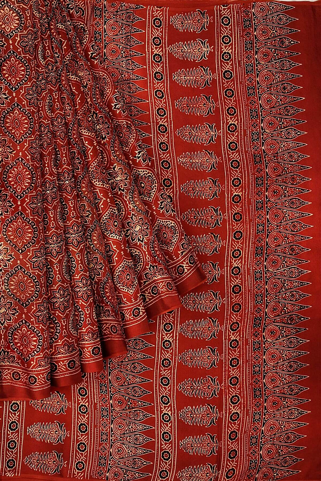 Modal silk saree in red in hand block ajrakh print in floral pattern