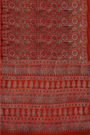 Modal silk saree in red in hand block ajrakh print in floral pattern