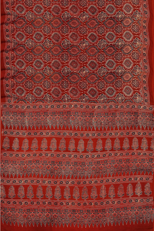 Modal silk saree in red in hand block ajrakh print in floral pattern