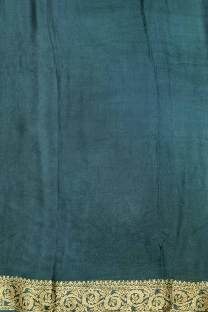 Modal silk saree in  shaded bottle green with zari pallu & borders.