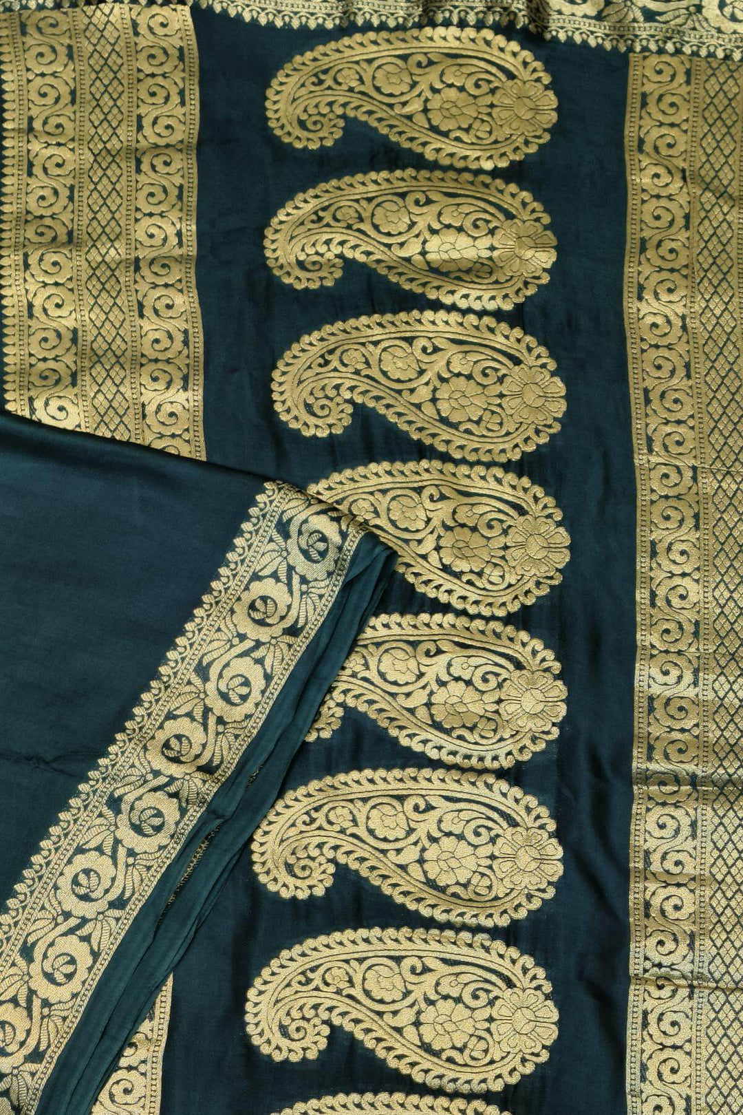 Modal silk saree in  shaded bottle green with zari pallu & borders.