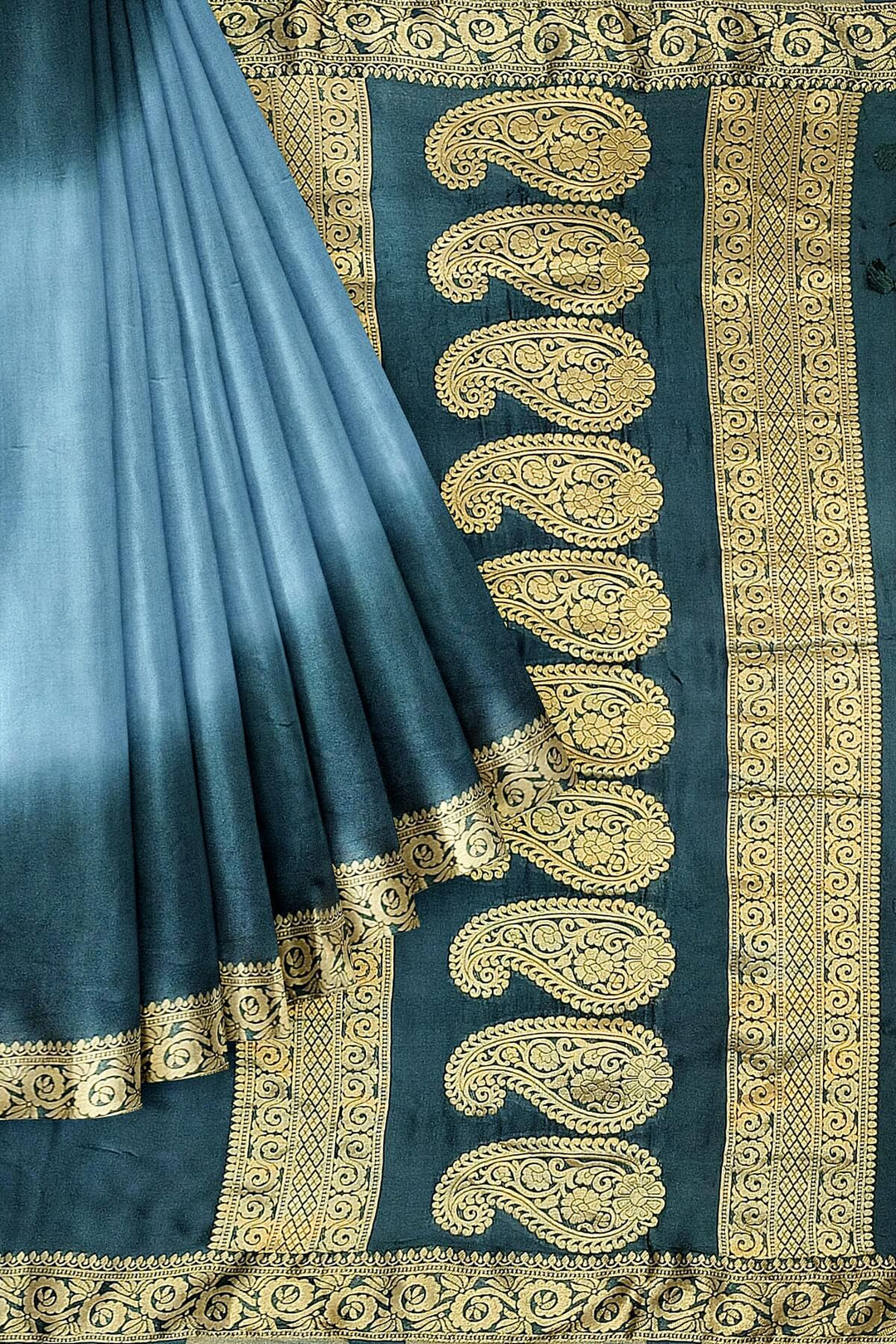 Modal silk saree in  shaded bottle green with zari pallu & borders.