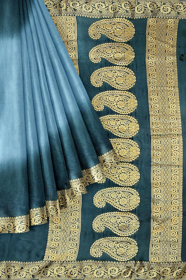 Modal silk saree in  shaded bottle green with zari pallu & borders.