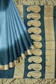 Modal silk saree in  shaded bottle green with zari pallu & borders.