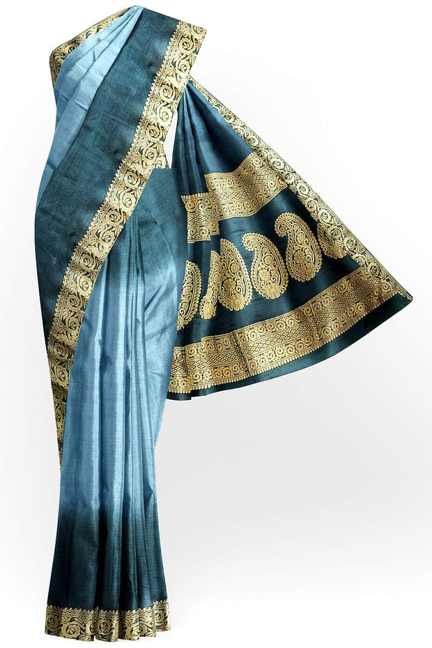 Modal silk saree in  shaded bottle green with zari pallu & borders.