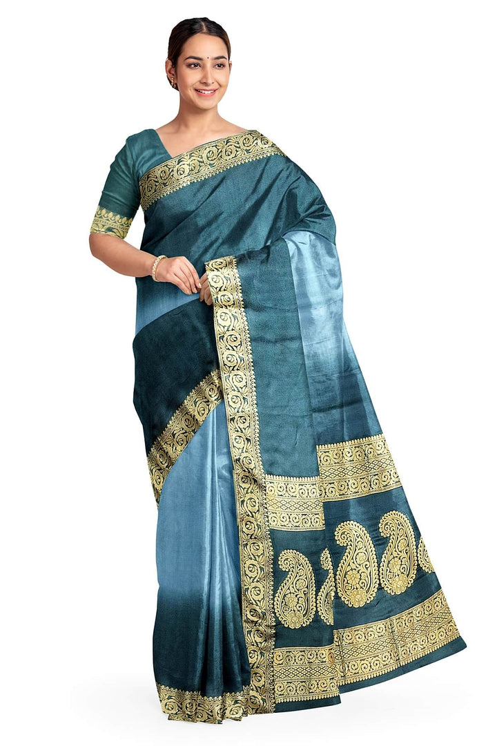 Modal silk saree in  shaded bottle green with zari pallu & borders.