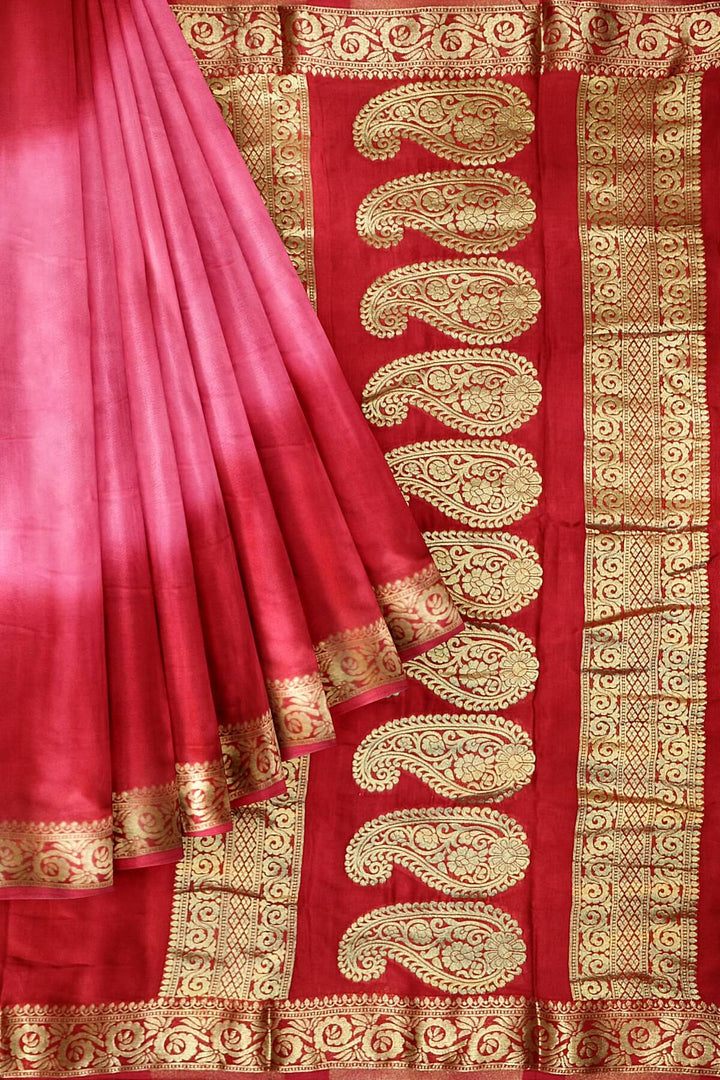 Modal silk saree in  shaded  pink with zari pallu & borders.