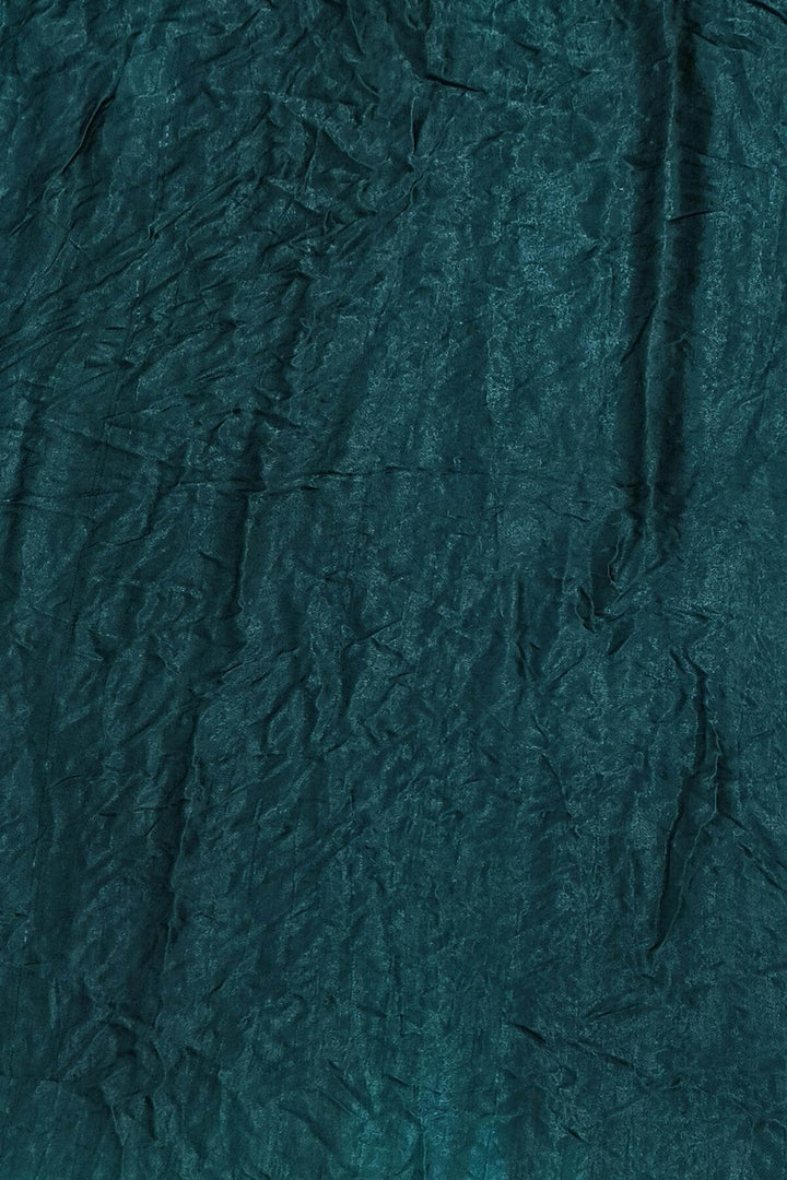 Modal silk bandhni saree  in bottle green with  tissue pallu