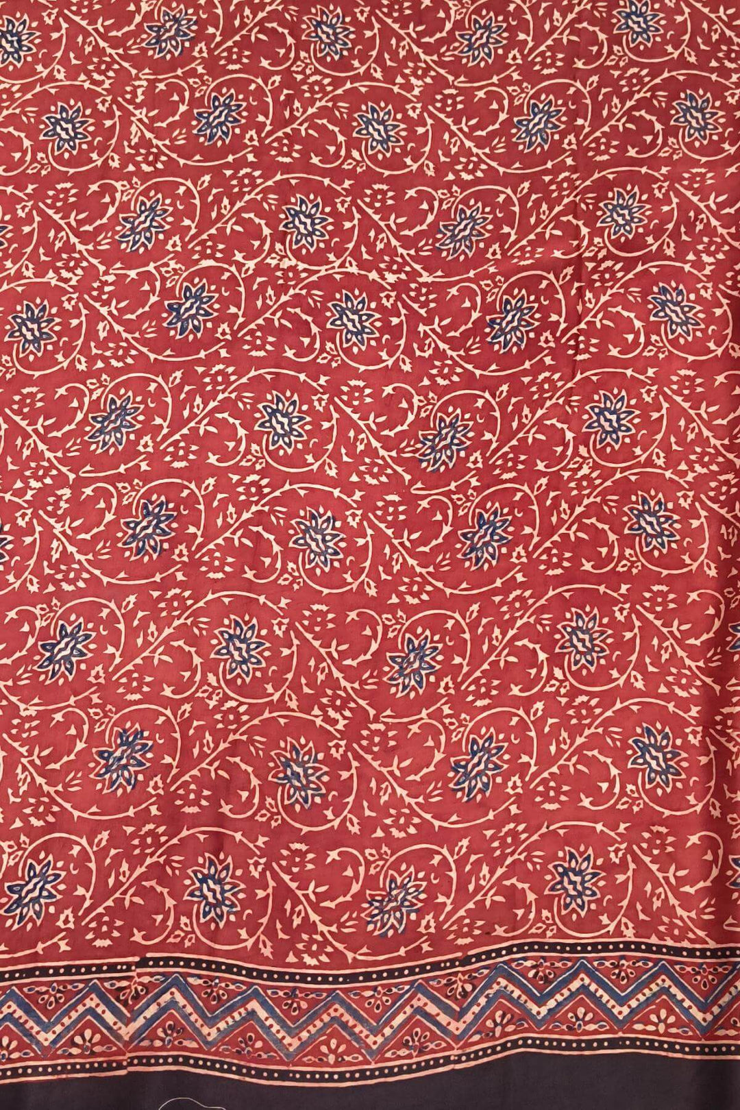 Modal silk saree in red in hand block ajrakh print