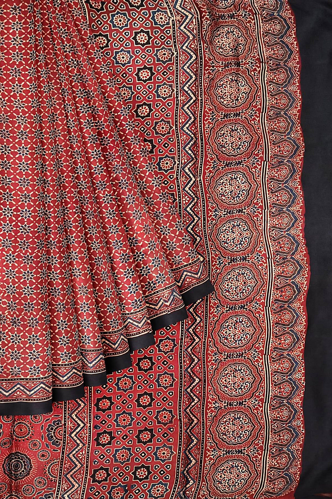 Modal silk saree in red in hand block ajrakh print