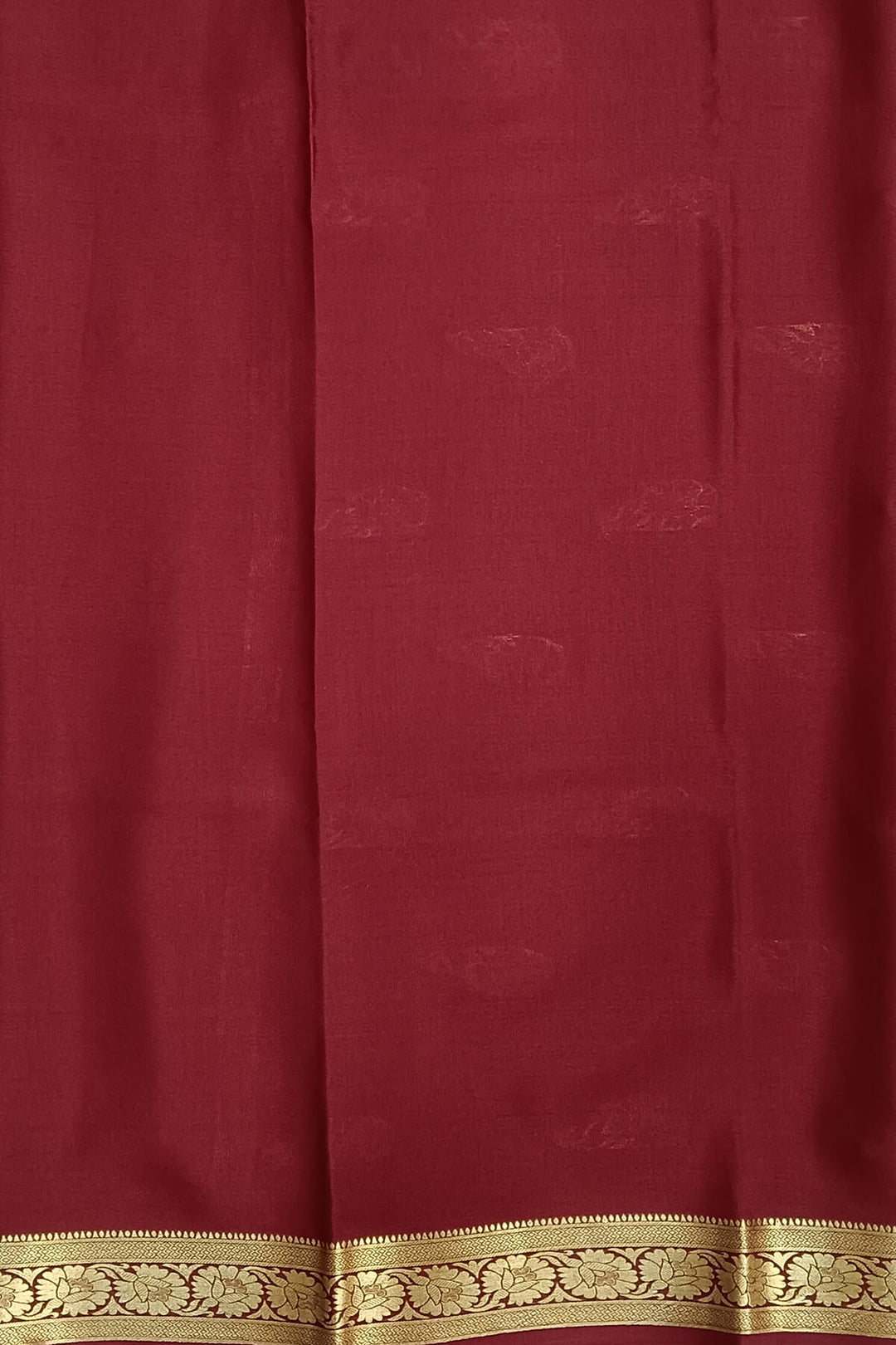 Mysore crepe pure silk saree in green with small motifs all over the body.