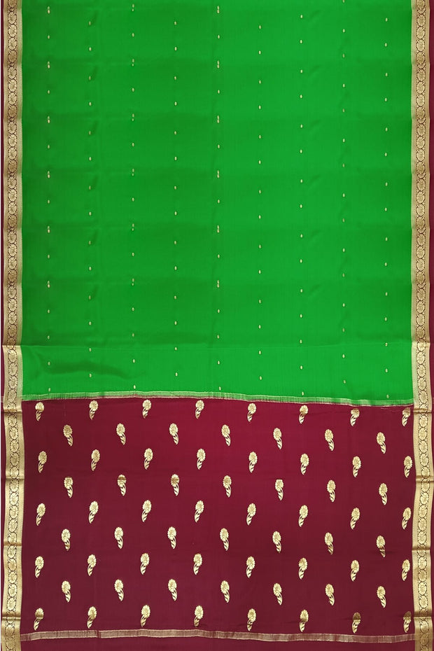 Mysore crepe pure silk saree in green with small motifs all over the body.