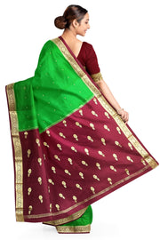 Mysore crepe pure silk saree in green with small motifs all over the body.
