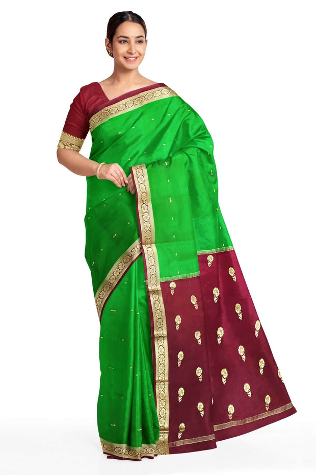 Mysore crepe pure silk saree in green with small motifs all over the body.