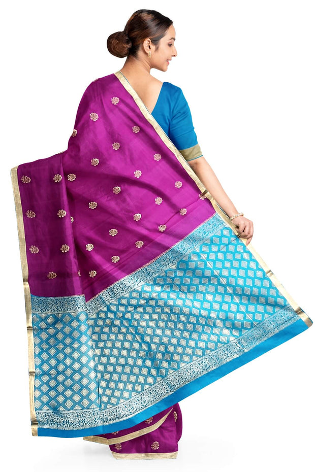 Mysore crepe silk saree in purple with floral  motifs all over the body.