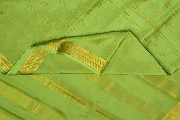 Mysore crepe pure silk saree in pista green  in fine zari checks all over the body