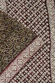 Organza silk saree  in olive green & black with kutch embroidery borders & pallu