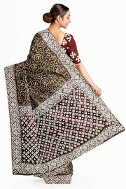 Organza silk saree  in olive green & black with kutch embroidery borders & pallu