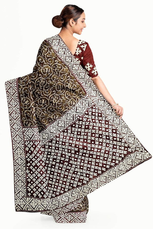Organza silk saree  in olive green & black with kutch embroidery borders & pallu