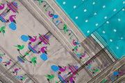 Paithani pure silk saree in teal green with small floral motifs all over the body.