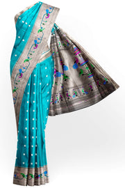 Paithani pure silk saree in teal green with small floral motifs all over the body.
