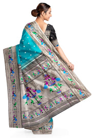 Paithani pure silk saree in teal green with small floral motifs all over the body.
