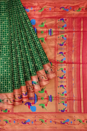 Paithani pure silk saree in bottle green with fine zari checks and floral motifs on the body.