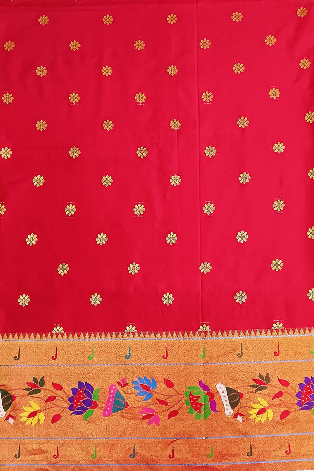 Paithani pure silk saree in peacock green  with floral motifs all over the body.