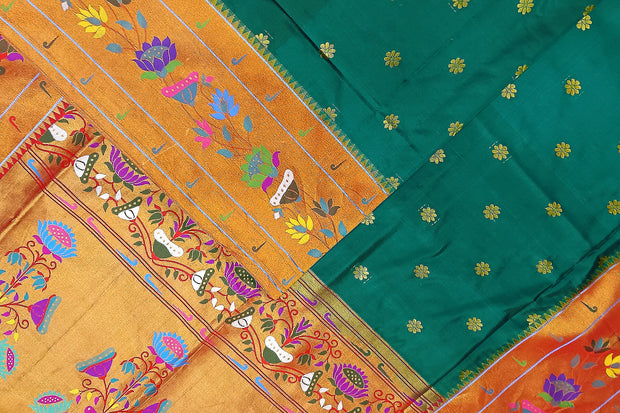 Paithani pure silk saree in peacock green  with floral motifs all over the body.