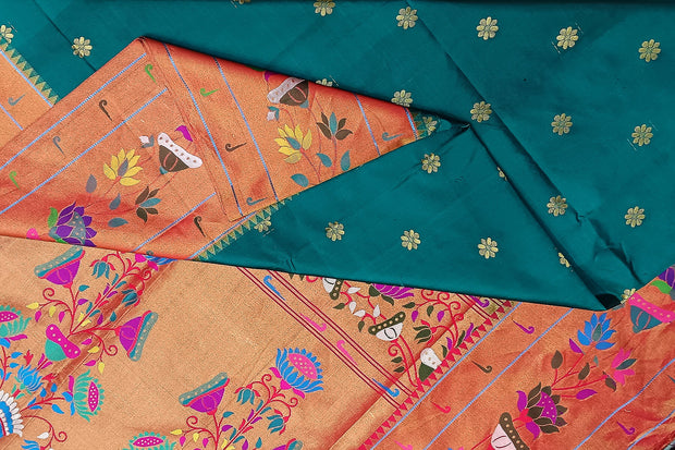 Paithani pure silk saree in peacock green  with floral motifs all over the body.