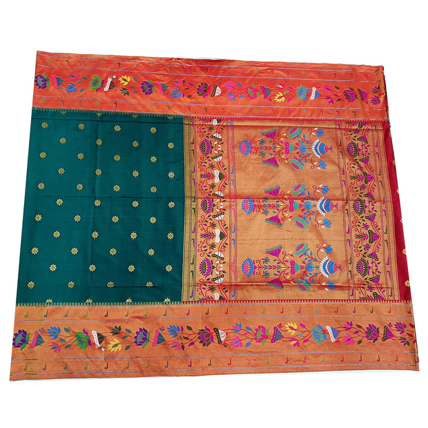 Paithani pure silk saree in peacock green  with floral motifs all over the body.