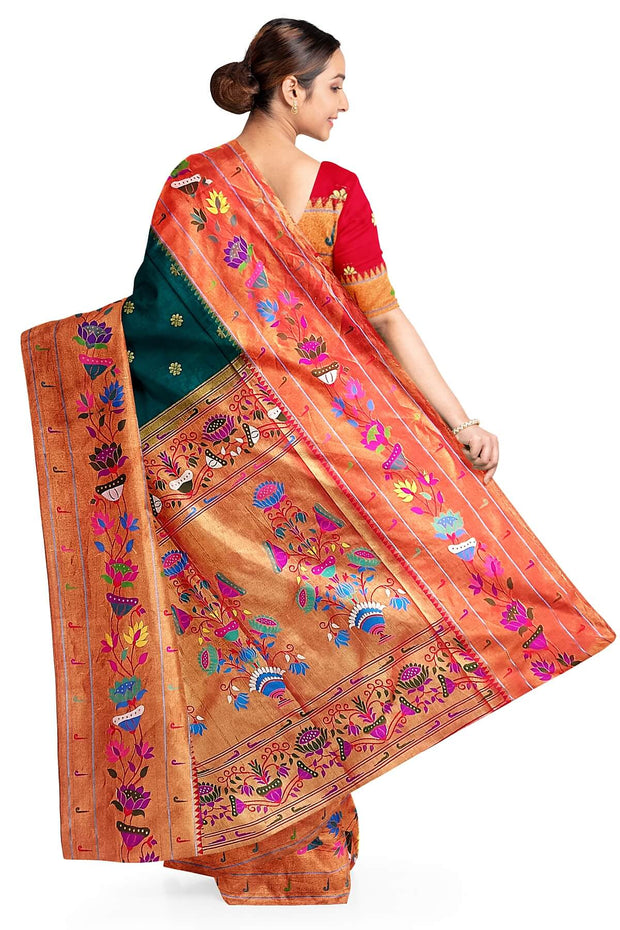 Paithani pure silk saree in peacock green  with floral motifs all over the body.
