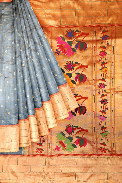 Paithani pure silk saree in grey with checks & buttis on the body .