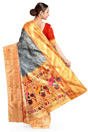 Paithani pure silk saree in grey with checks & buttis on the body .