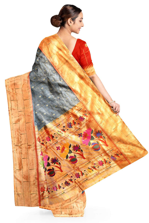 Paithani pure silk saree in grey with checks & buttis on the body .