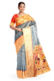 Paithani pure silk saree in grey with checks & buttis on the body .