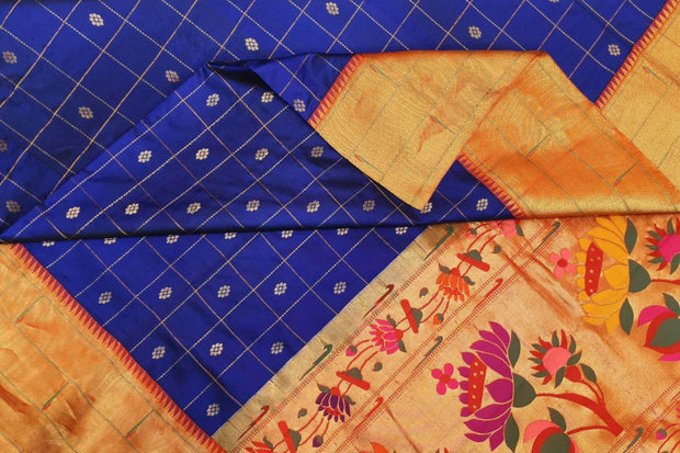 Paithani pure silk saree in violet with checks & buttis on the body .