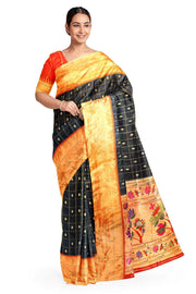 Paithani pure silk saree in black with checks & buttis on the body .