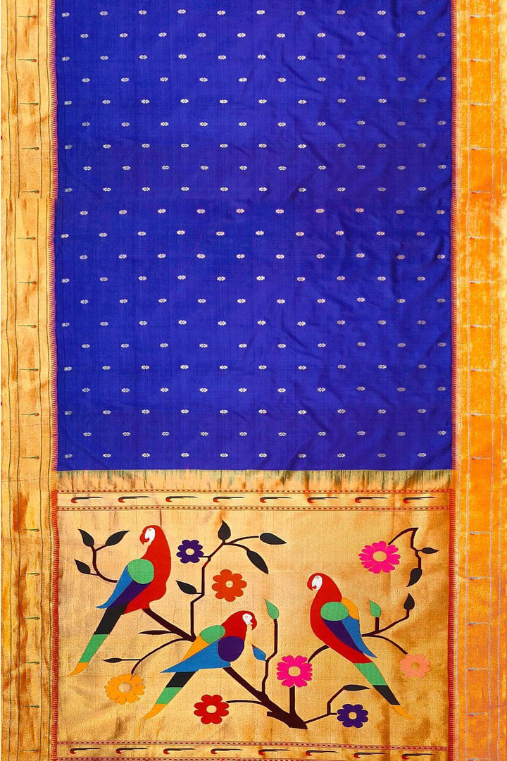 Paithani pure silk saree in royal blue with small floral motifs  on the body .