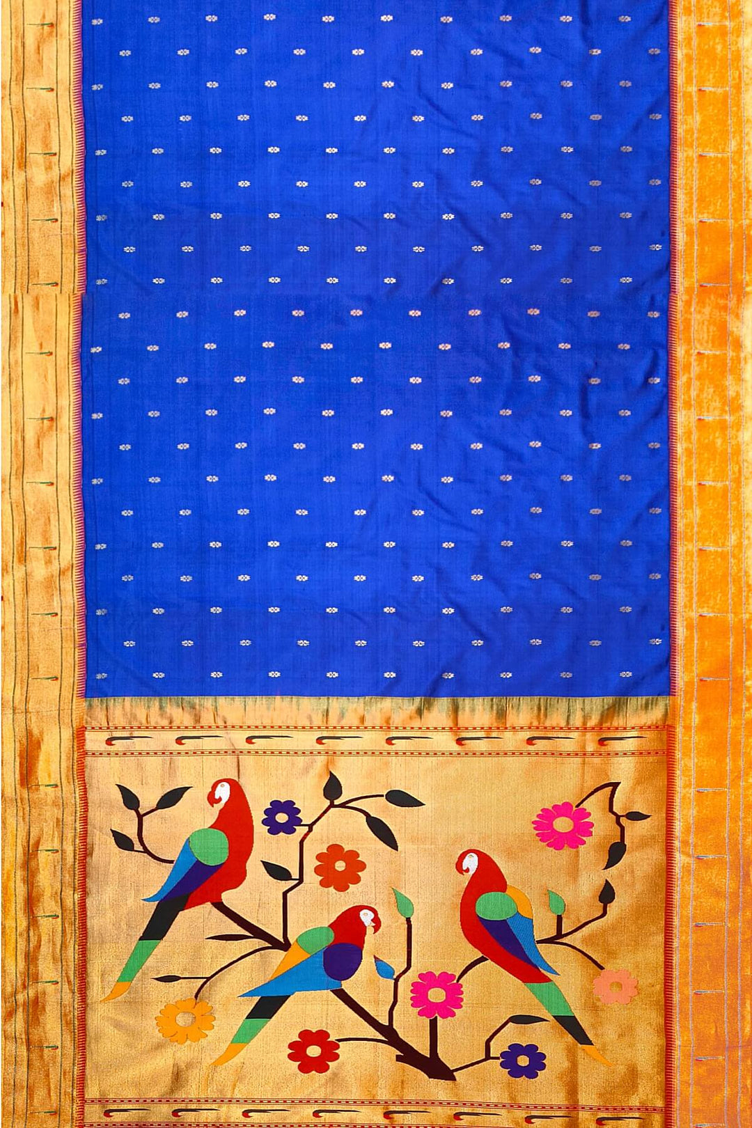 Paithani pure silk saree in royal blue with small floral motifs  on the body .