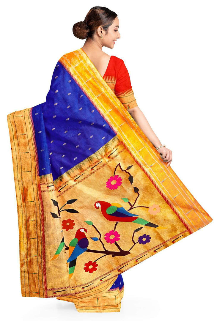 Paithani pure silk saree in royal blue with small floral motifs  on the body .